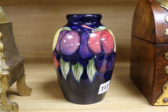 A Moorcroft vase wisteria and fruits Height 16cm